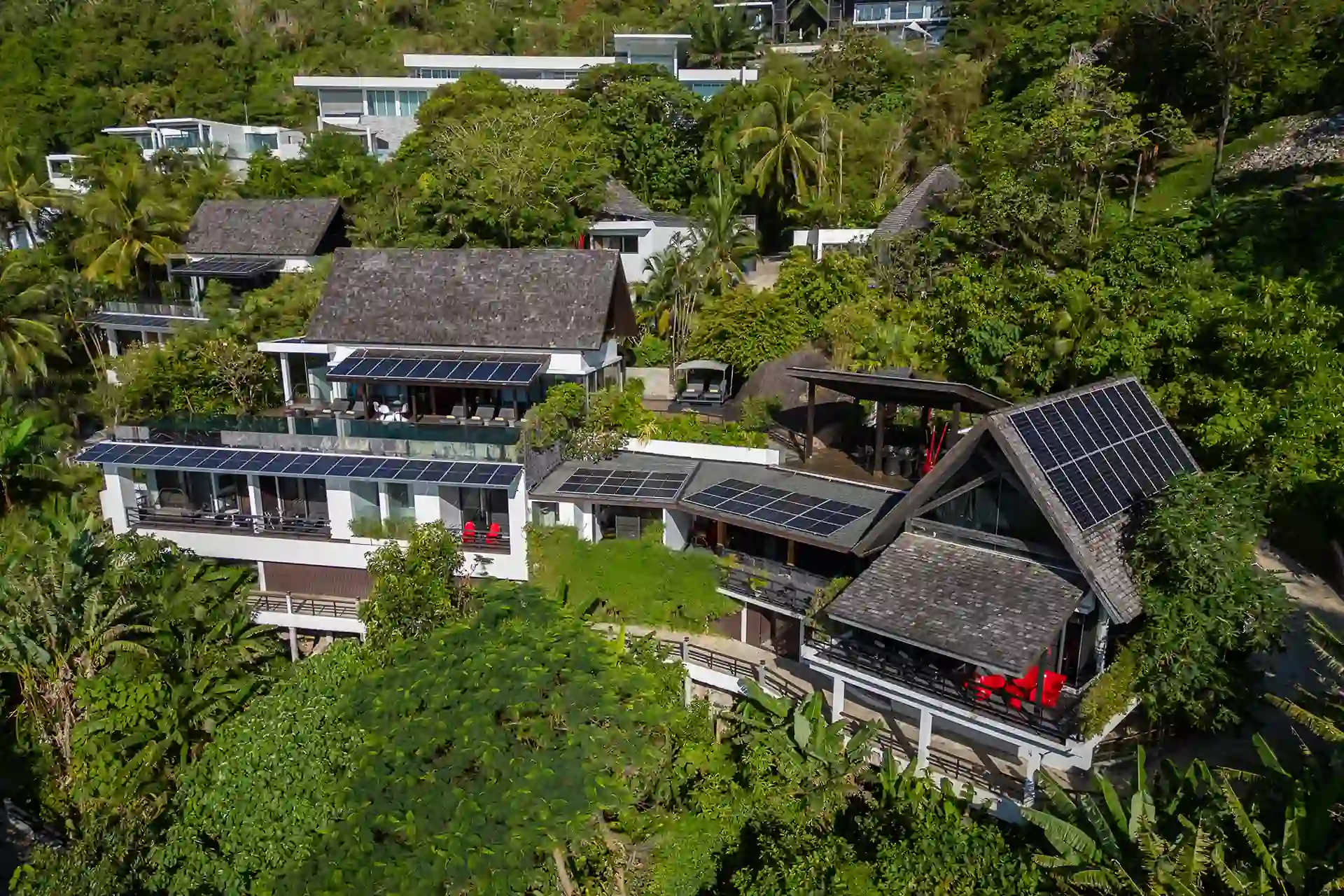 Villa Yin Kamala Headland aerial exterior showing solar roofs and gardens