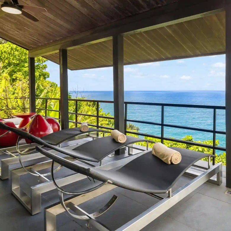 Villa Yin Kamala Headland covered terrace lounge with ocean outlook and beds