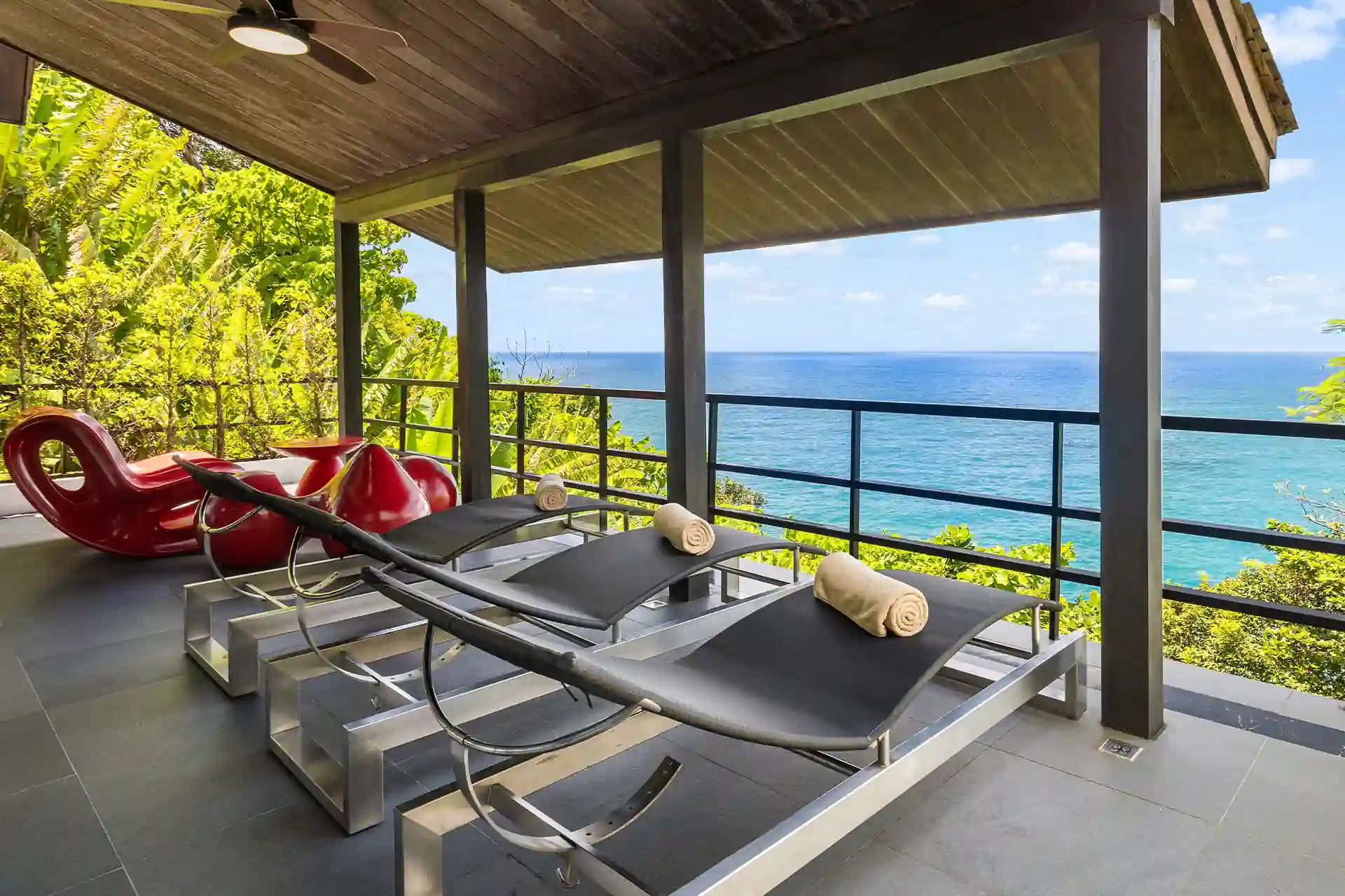 Villa Yin Kamala Headland covered terrace lounge with ocean outlook and beds