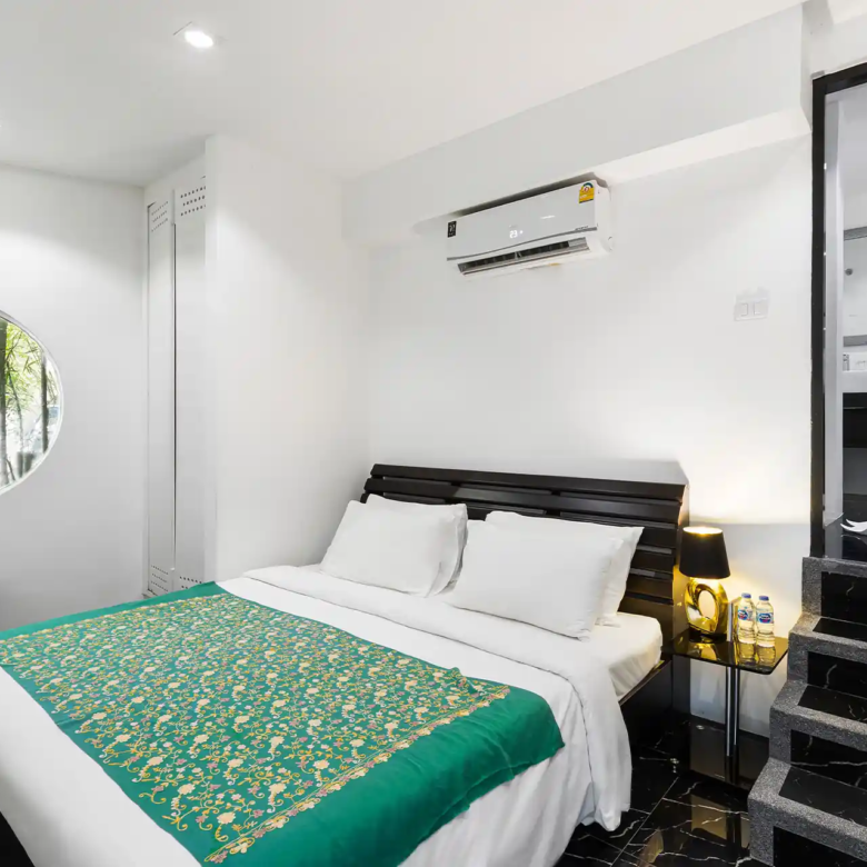 Villa Yin Kamala Headland intimate bedroom with garden window and ensuite