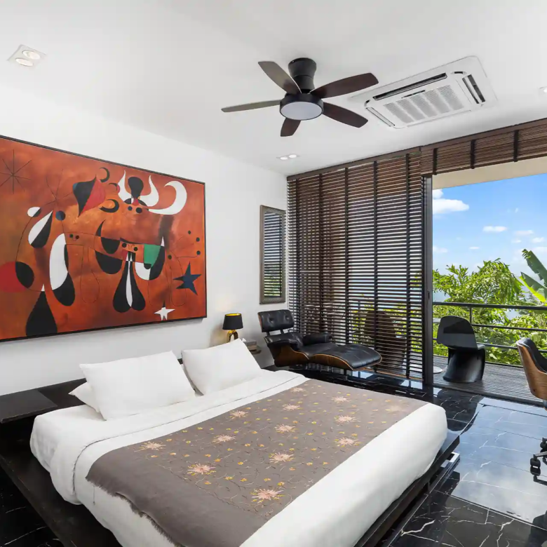 Villa Yin Kamala Headland guest bedroom with balcony and sea glimpse