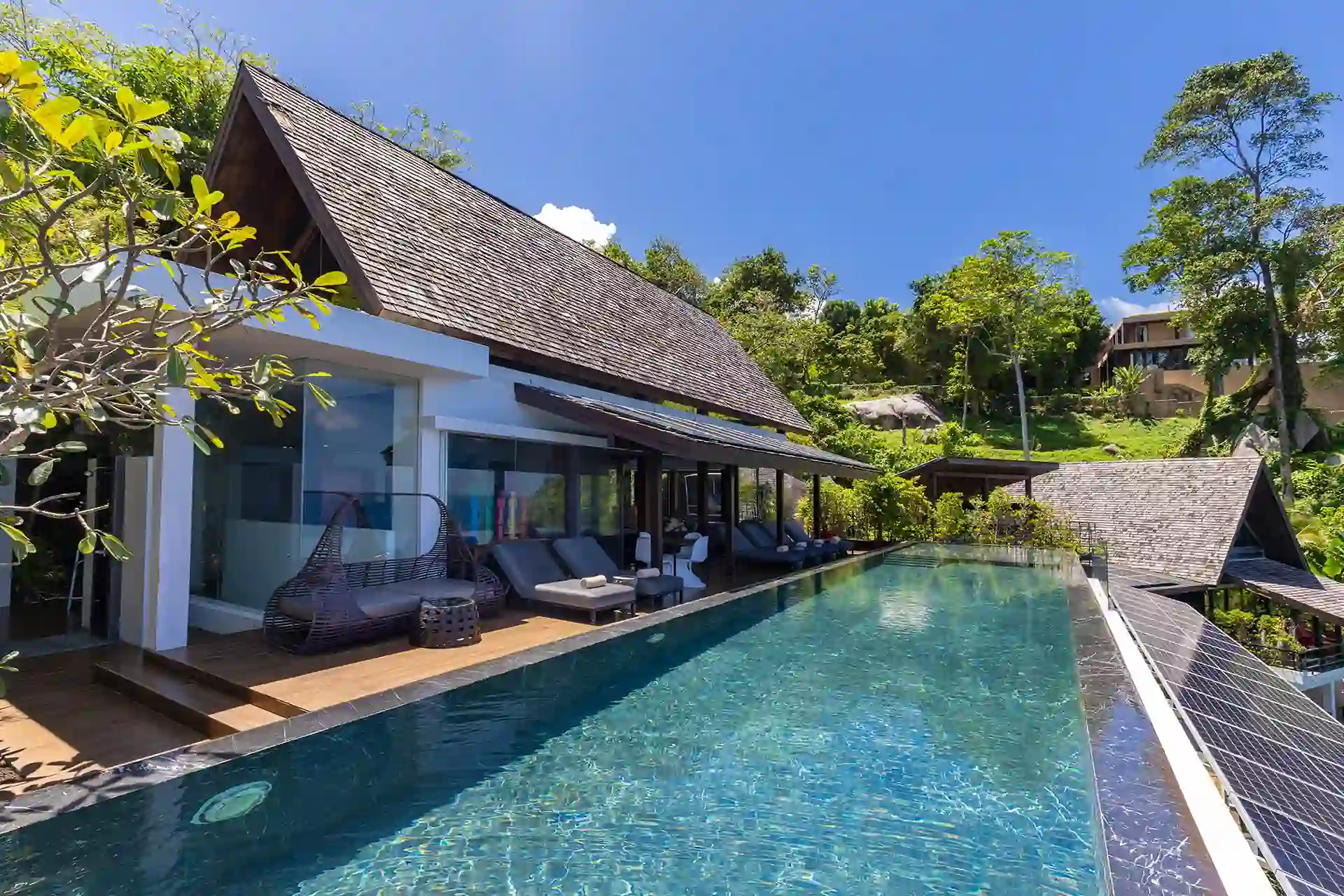 Villa Yin Kamala Headland long infinity pool beside pavilion and greenery