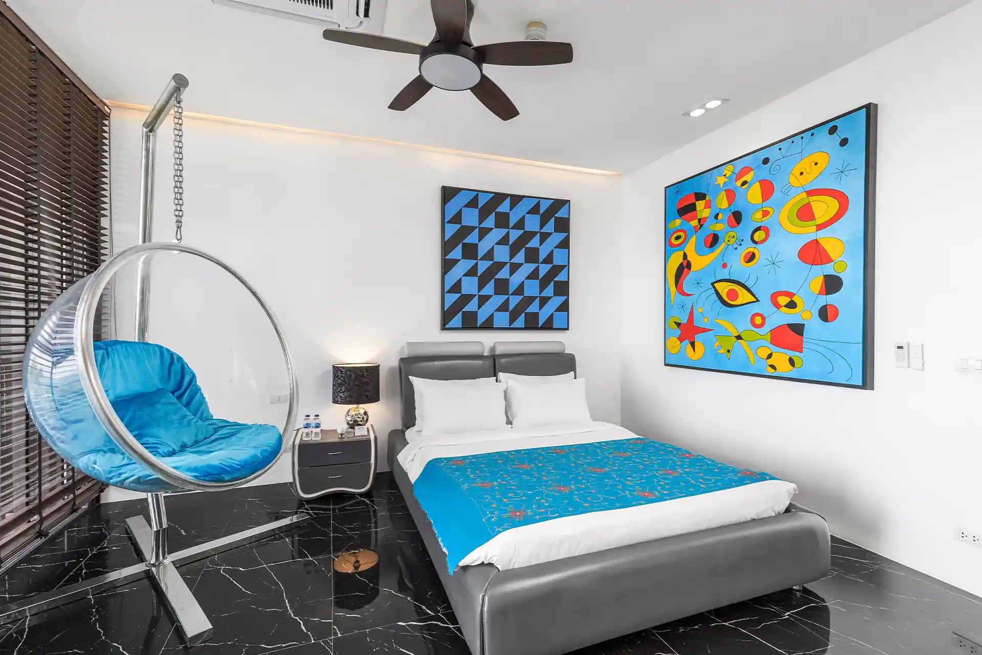 Villa Yin Kamala Headland modern guest bedroom with art and bubble chair