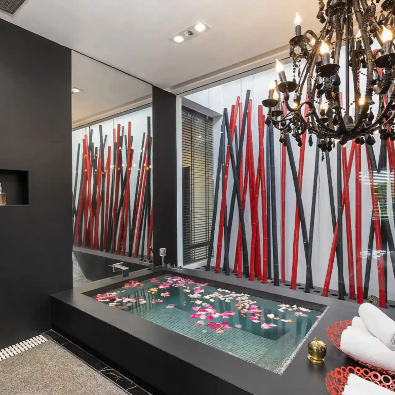 Villa Yin Kamala Headland spa bathroom with flower-filled soaking tub