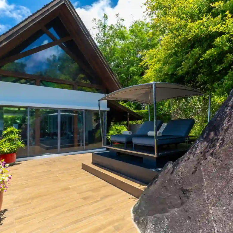 Villa Yin Kamala Headland sunny deck with canopy daybeds by pavilion