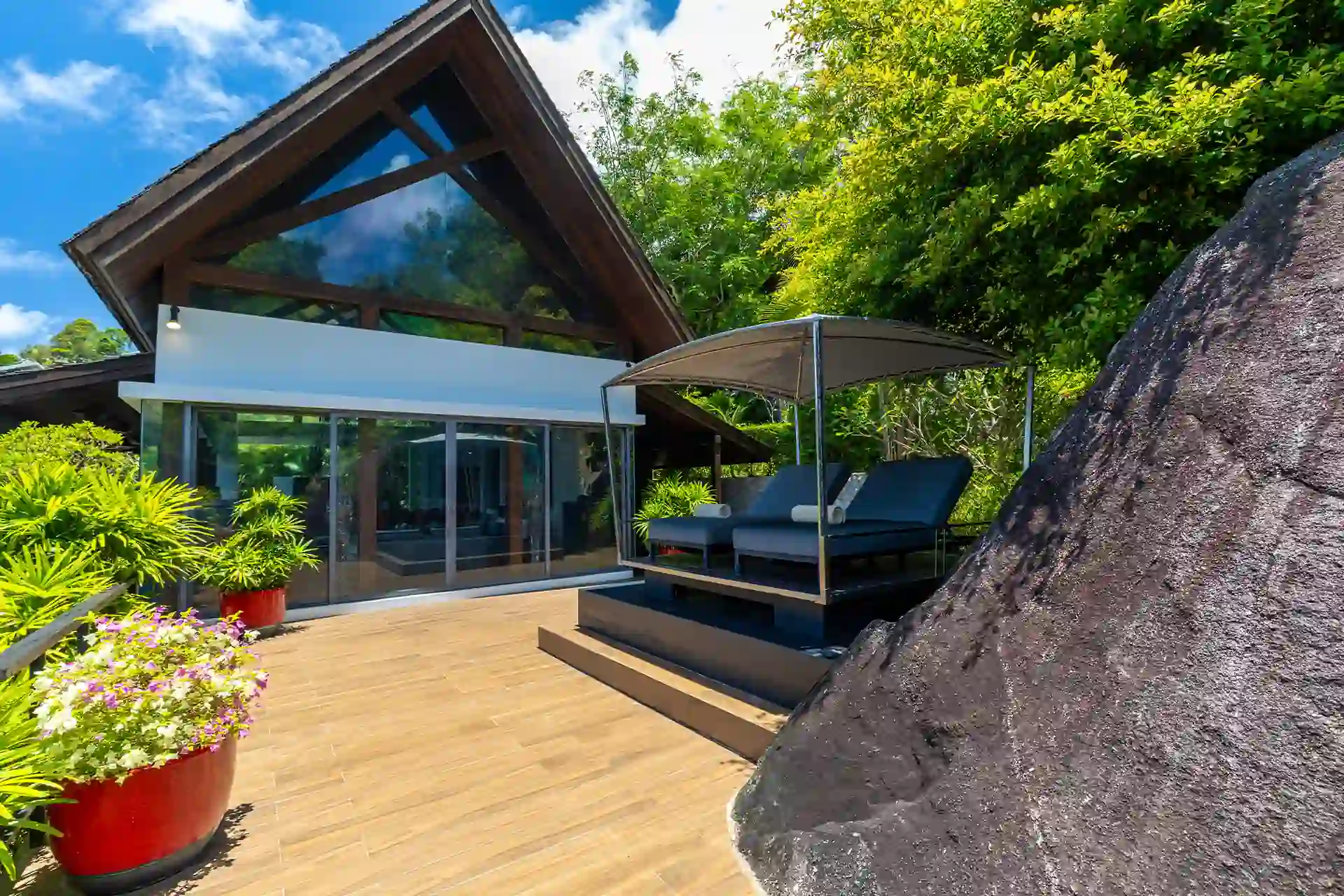 Villa Yin Kamala Headland sunny deck with canopy daybeds by pavilion