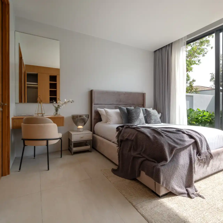 Botanica Four Season Thalang cozy bedroom with vanity desk and pool access
