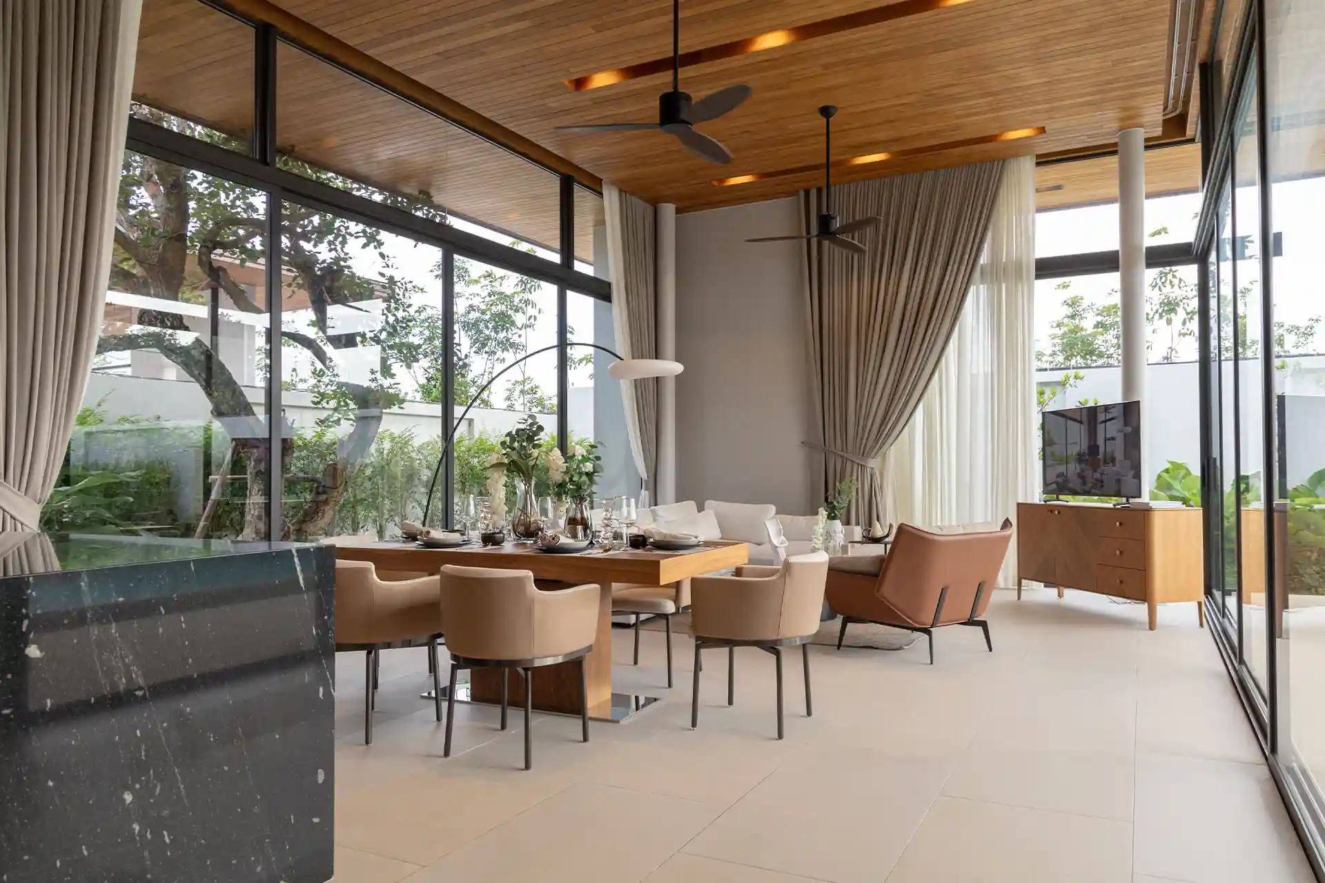 Botanica Four Season Thalang elegant dining area beside glass living wall