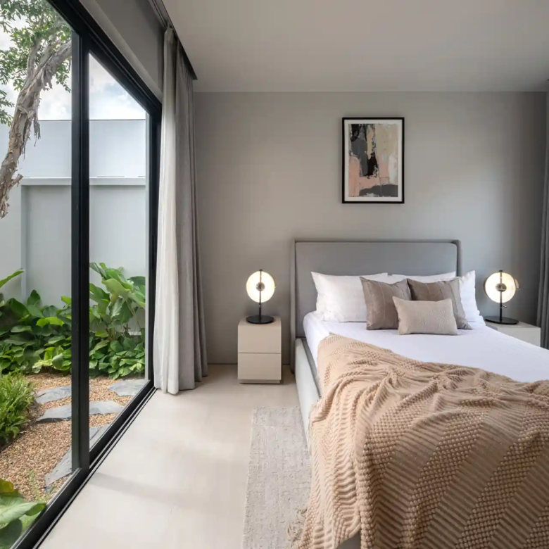 Botanica Four Season Thalang bedroom overlooking private garden courtyard with tree