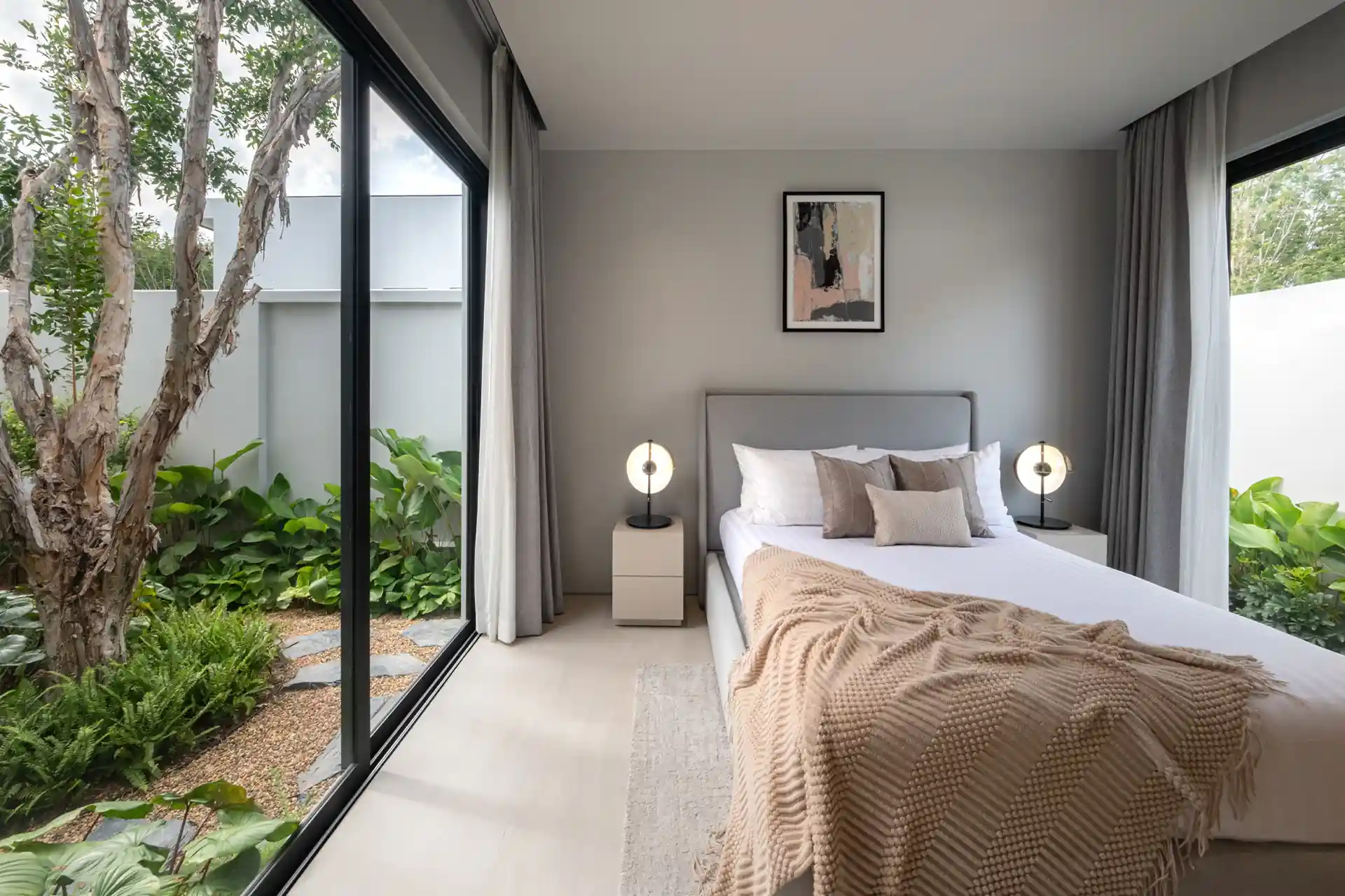 Botanica Four Season Thalang bedroom overlooking private garden courtyard with tree