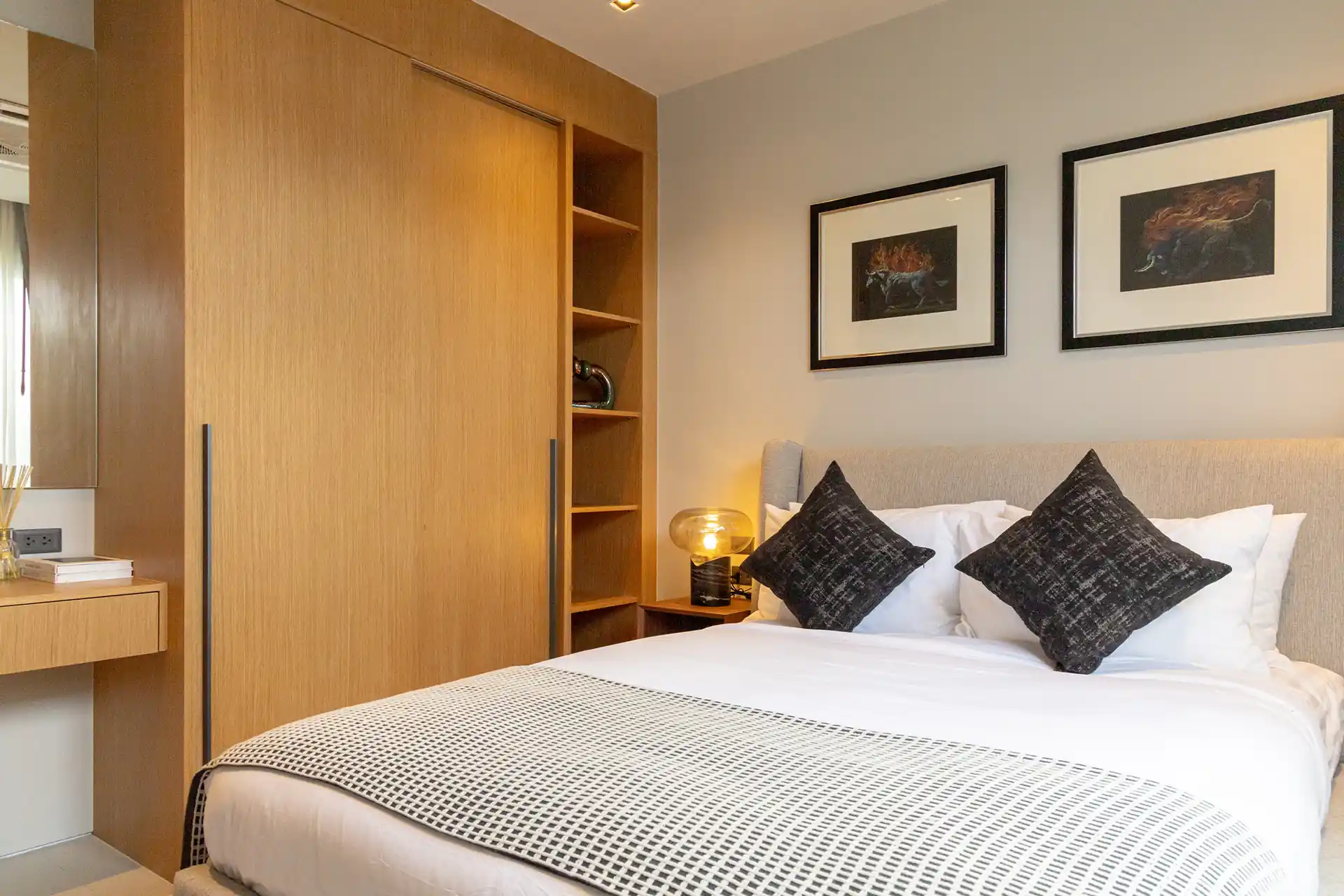 Botanica Four Season Thalang stylish guest bedroom with sliding wardrobe and shelving