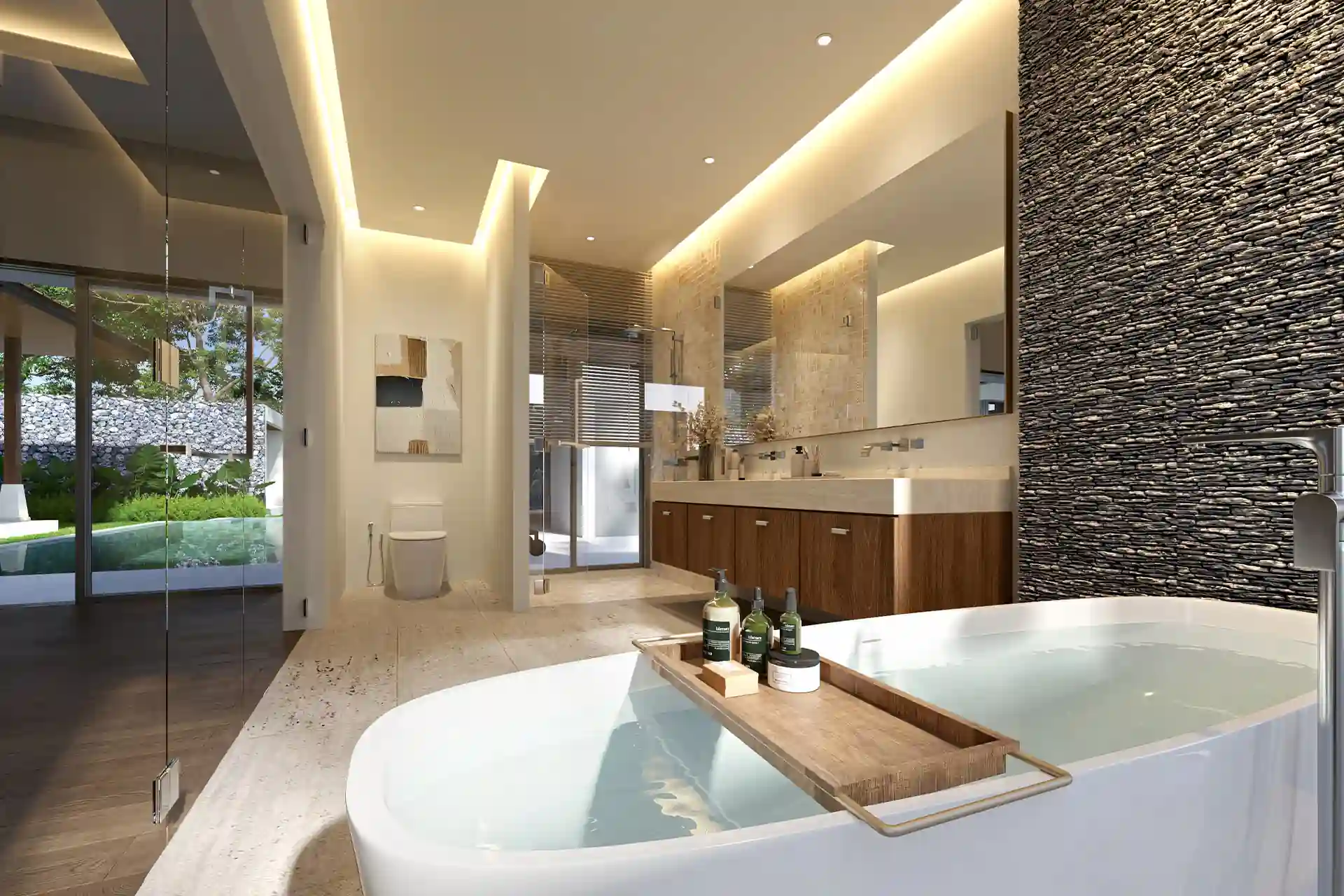 Botanica Four Season Thalang luxury bathroom with freestanding bathtub and stone wall