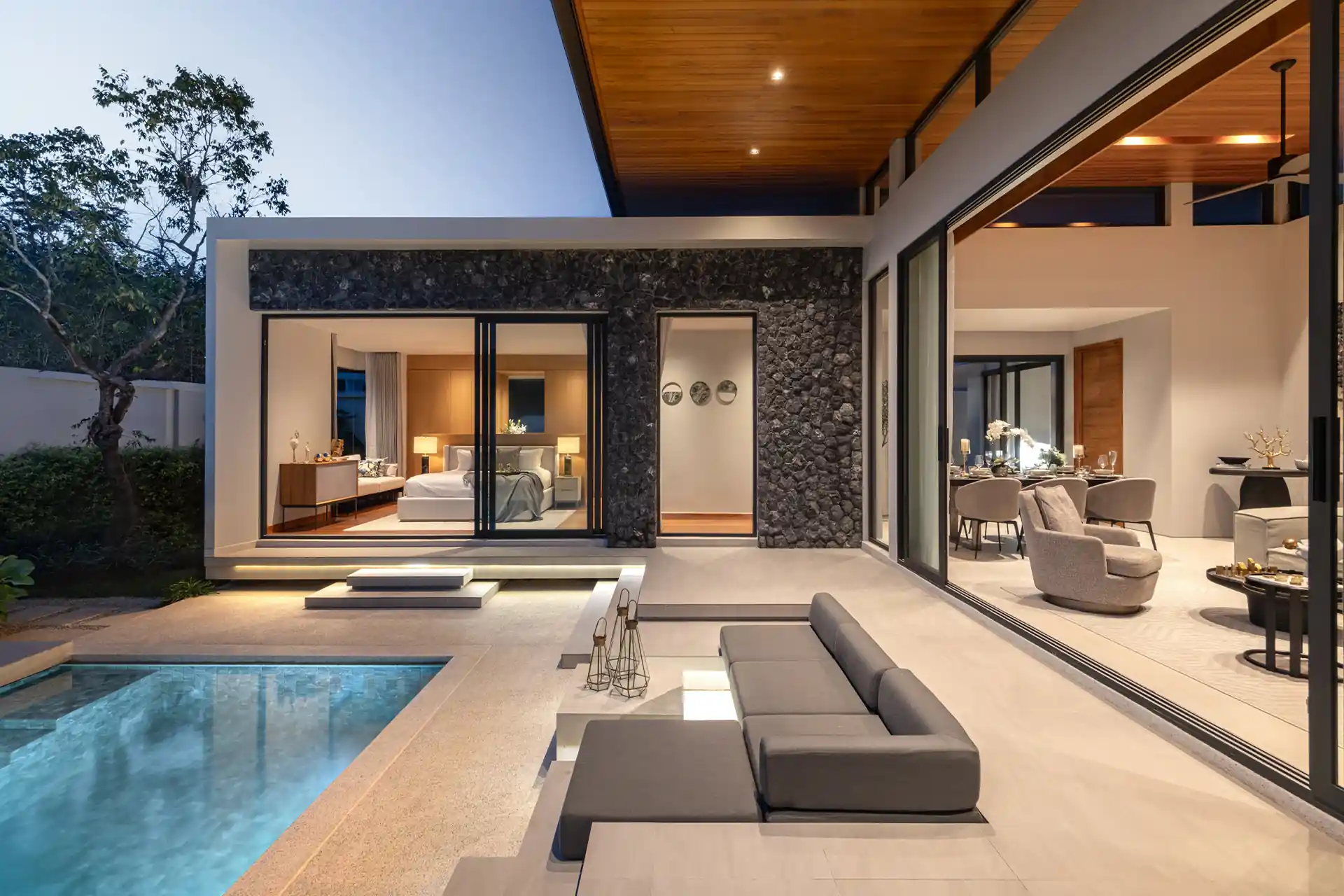 Botanica Four Season Thalang night pool terrace with bedroom and living room
