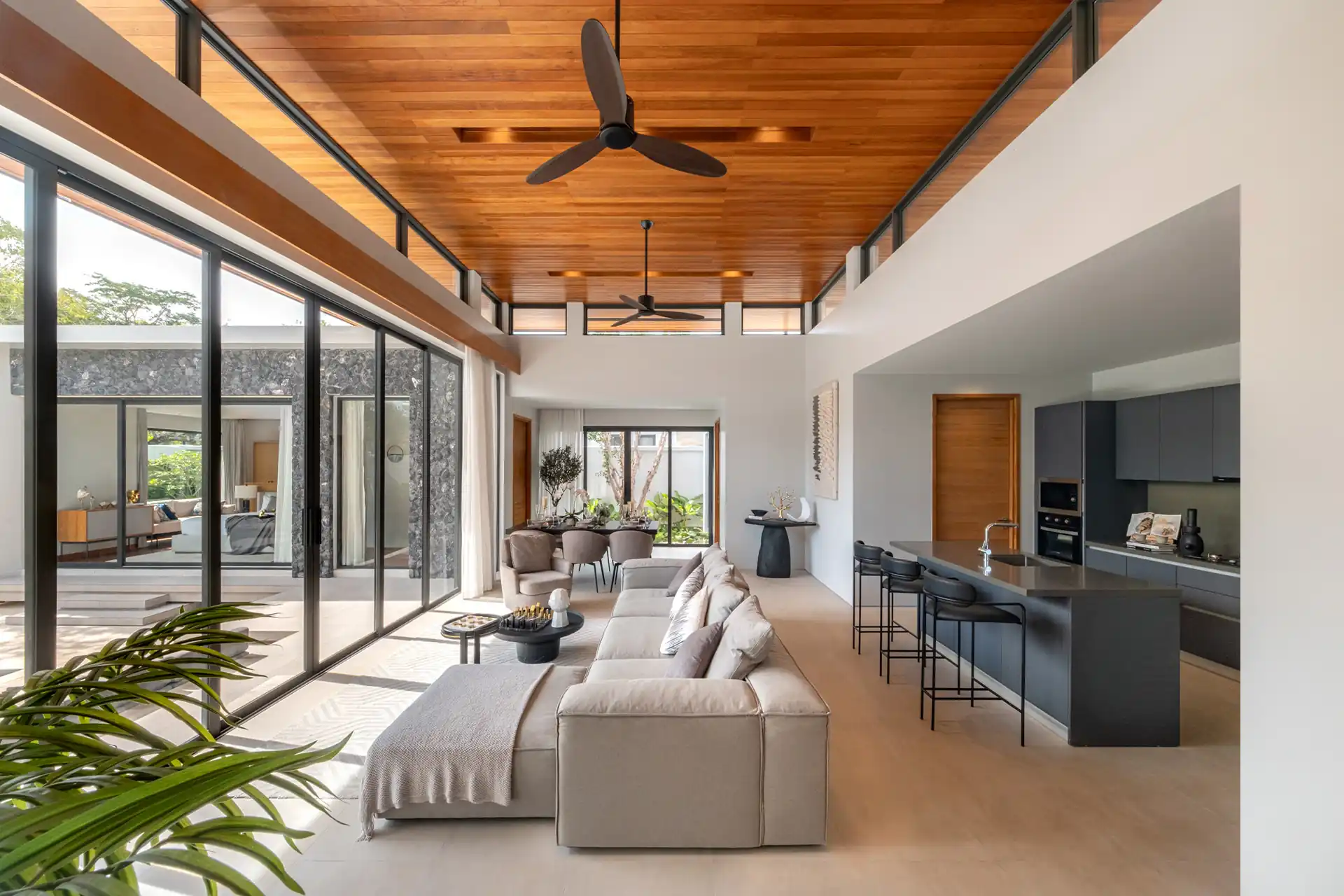 Botanica Four Season Thalang long open-plan lounge with garden views
