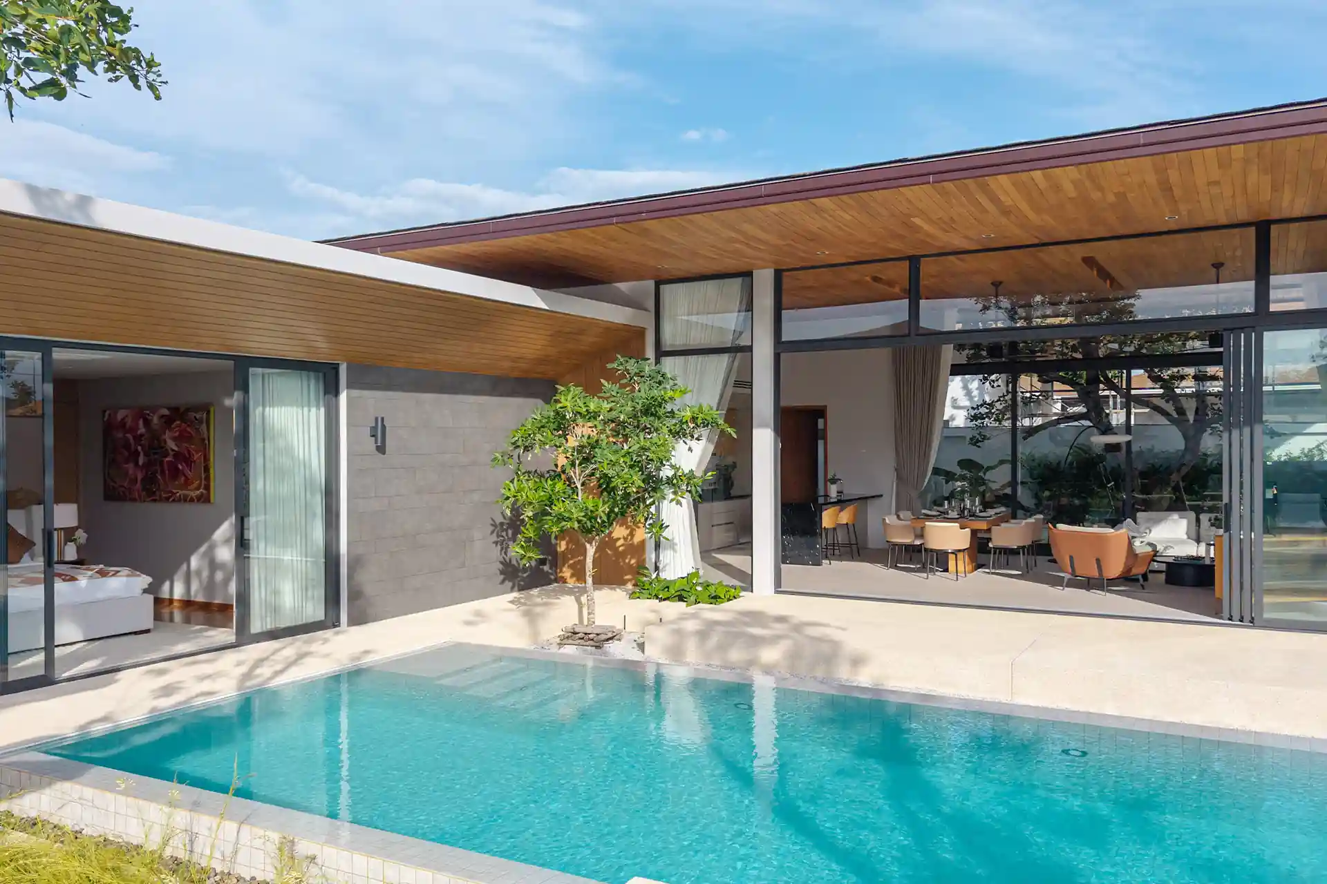 Botanica Four Season Thalang poolside pavilion with bedroom and dining area