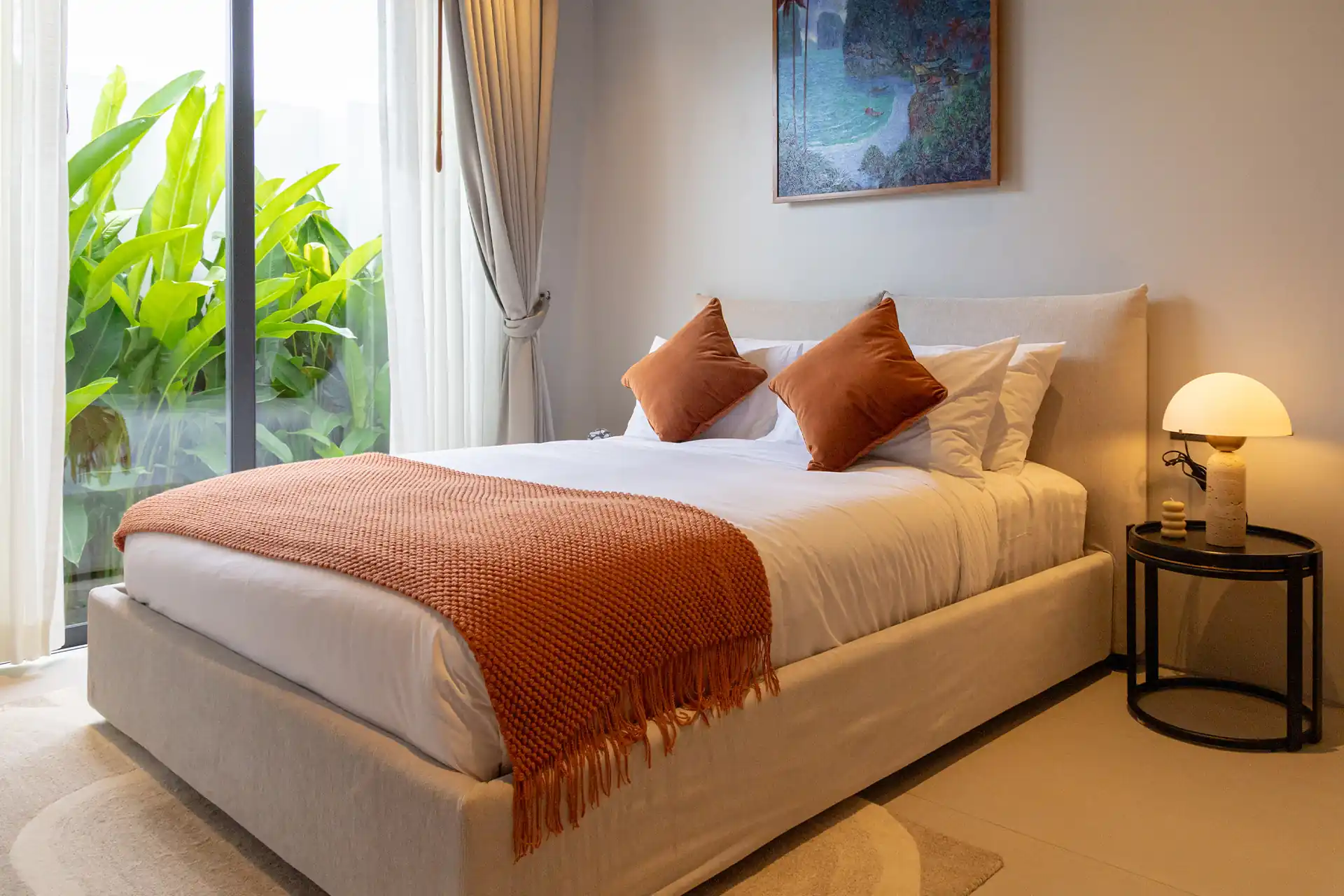 Botanica Four Season Thalang cozy bedroom with tropical garden view and soft lighting