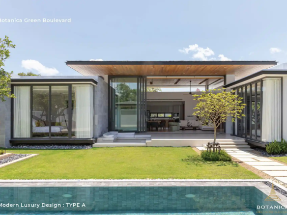 Botanica Green Boulevard Pool Villas twilight pool view with glowing interiors