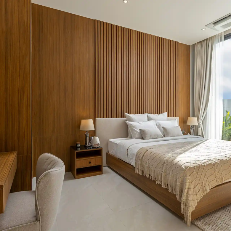 Mouana Cherng Talay main bedroom with warm wood wall and terrace