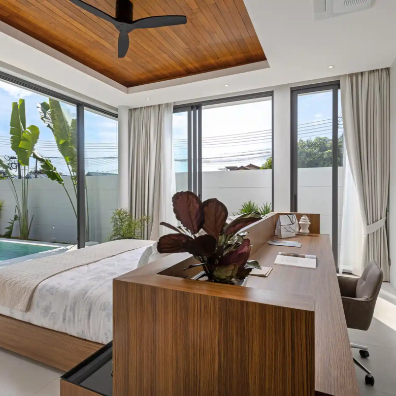 Mouana Cherng Talay bedroom with pool view and integrated working desk