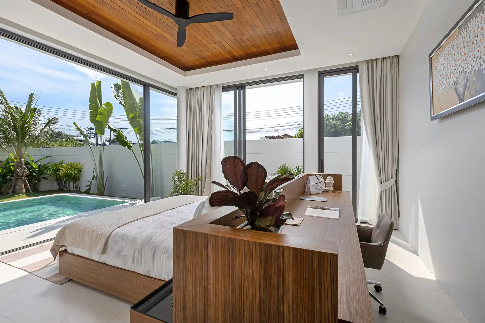 Mouana Cherng Talay bedroom with pool view and integrated working desk
