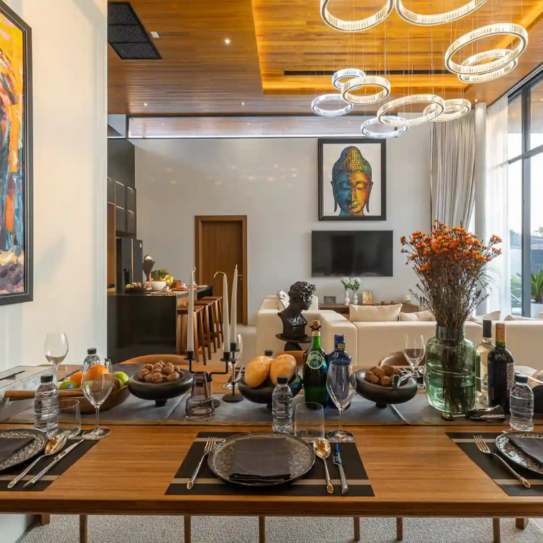 Mouana Cherng Talay elegant dining setting overlooking pool and living area