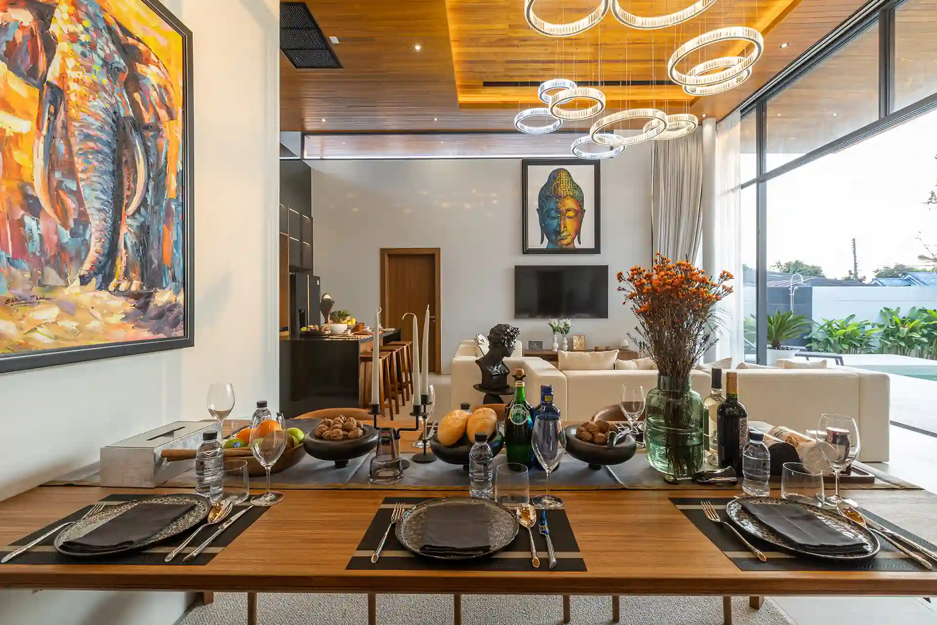Mouana Cherng Talay elegant dining setting overlooking pool and living area