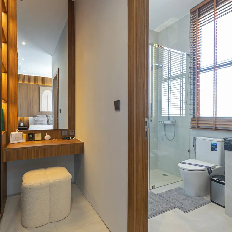 Mouana Cherng Talay vanity corner leading to ensuite bathroom and shower