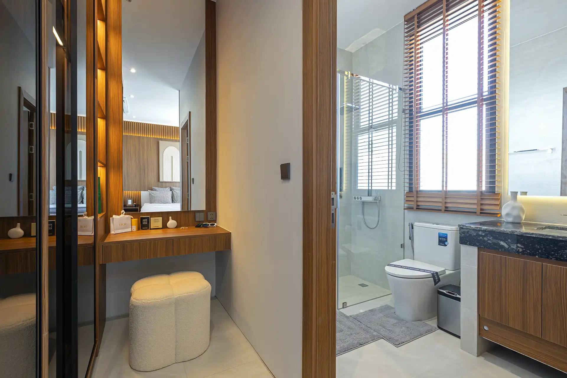 Mouana Cherng Talay vanity corner leading to ensuite bathroom and shower