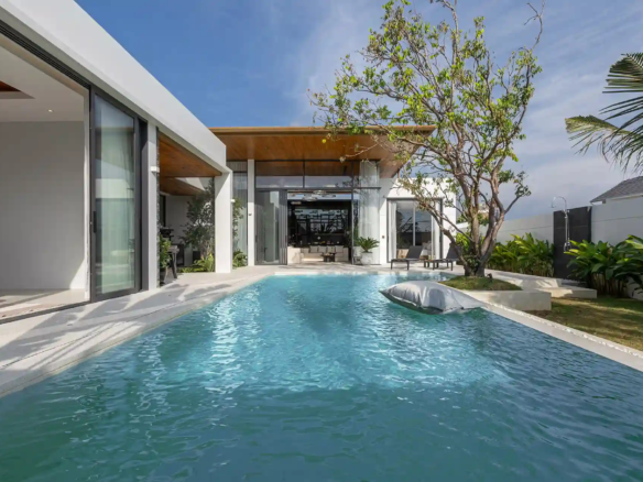 Mouana Cherng Talay long lap pool with tropical garden and villa