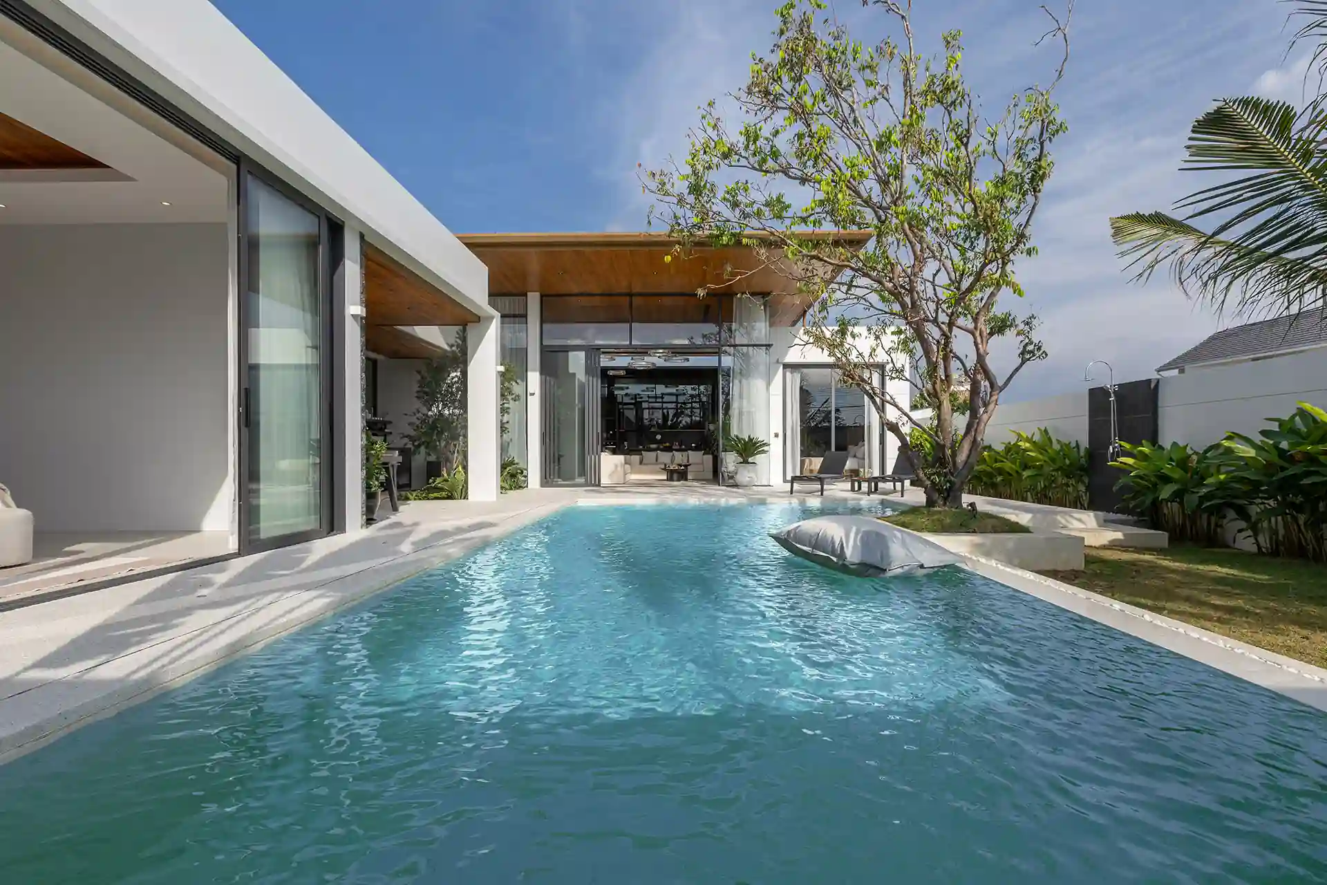 Mouana Cherng Talay long lap pool with tropical garden and villa