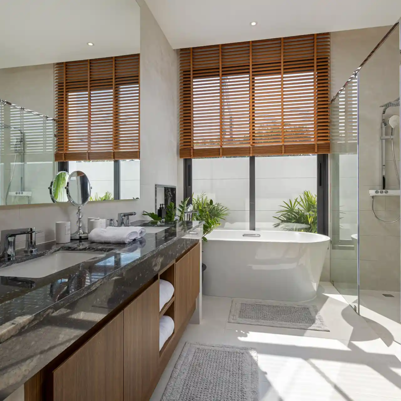 Mouana Cherng Talay bathroom with freestanding tub and garden views