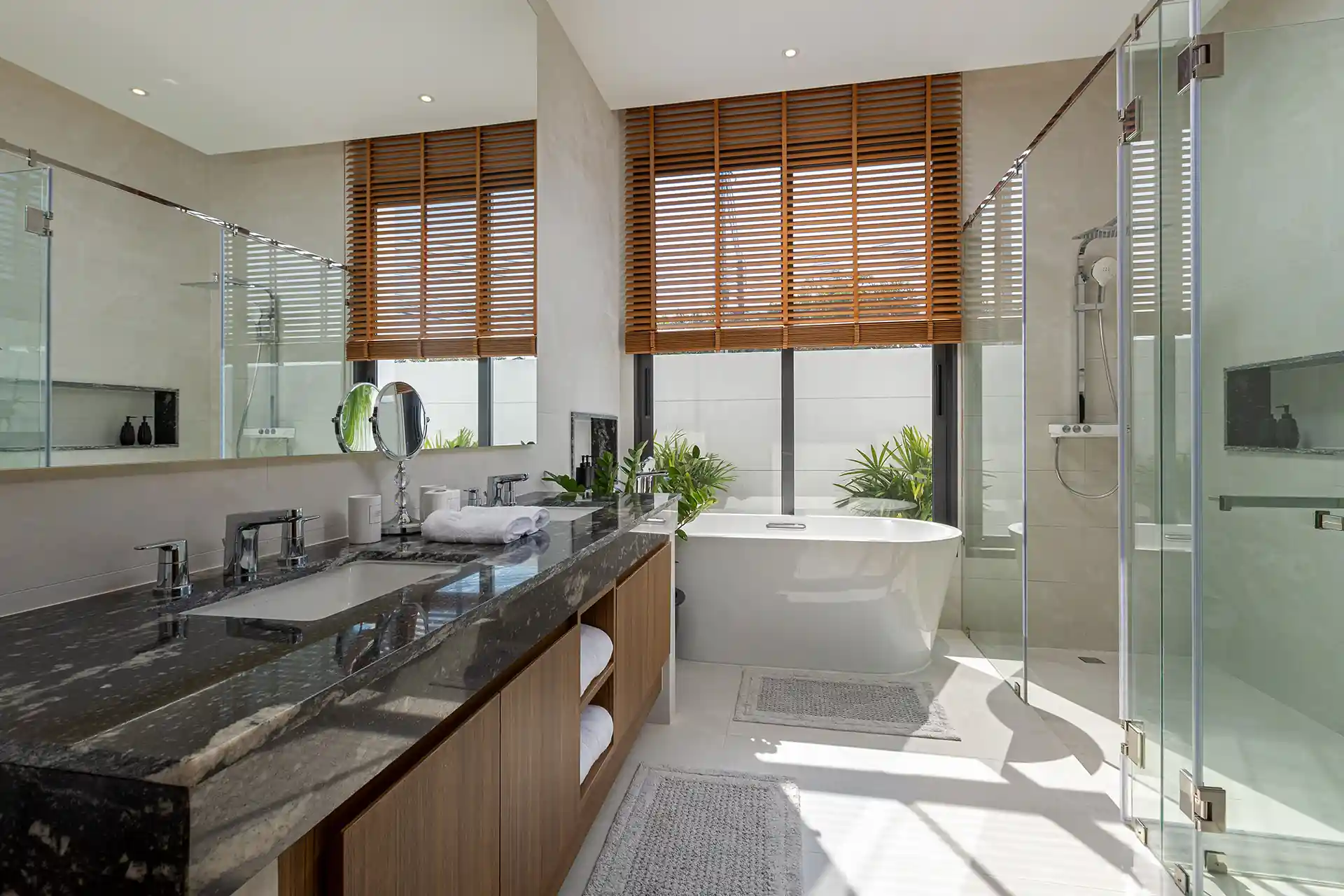 Mouana Cherng Talay bathroom with freestanding tub and garden views