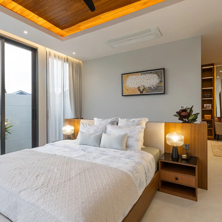 Mouana Cherng Talay cozy master bedroom with warm lighting and dressing nook