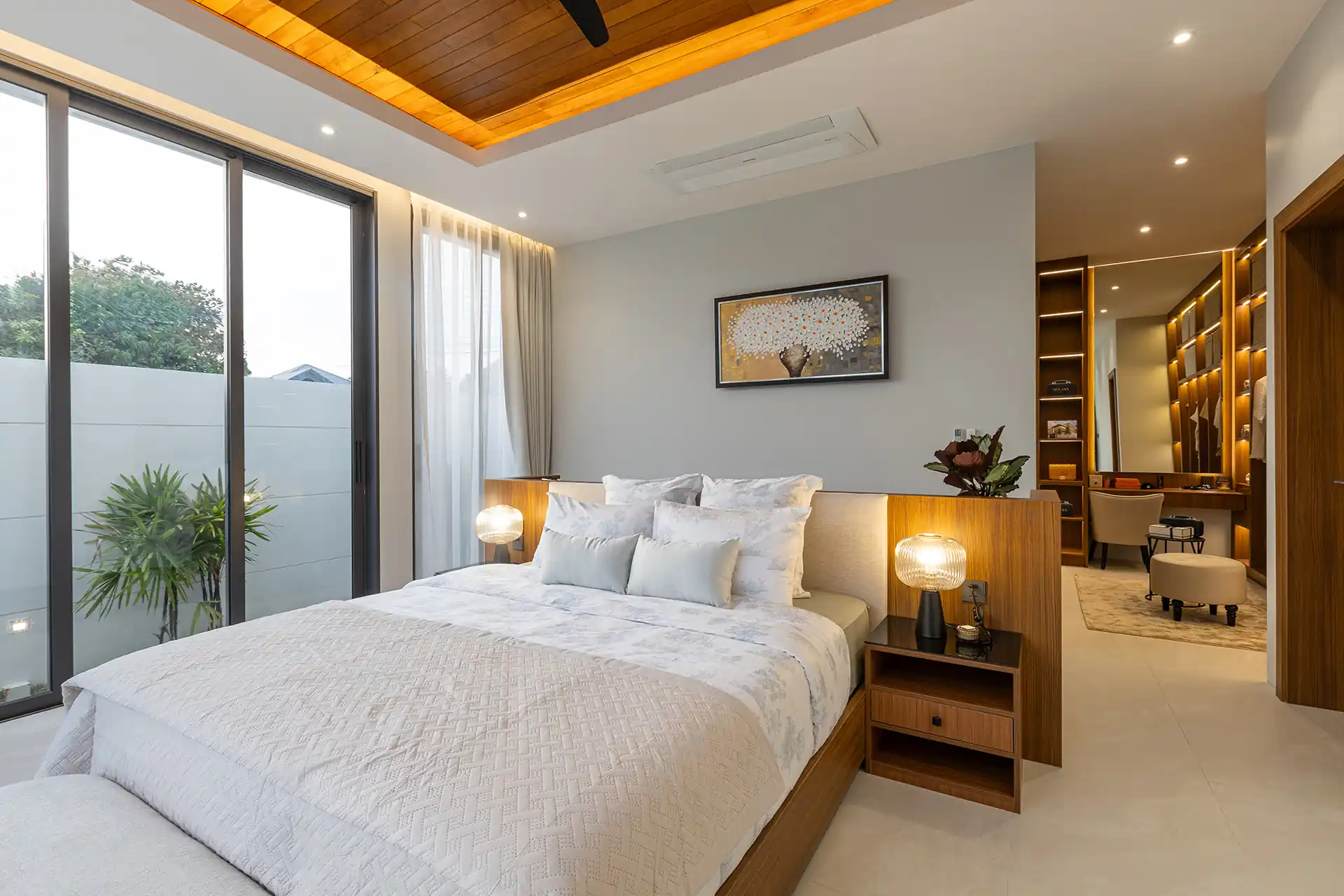 Mouana Cherng Talay cozy master bedroom with warm lighting and dressing nook