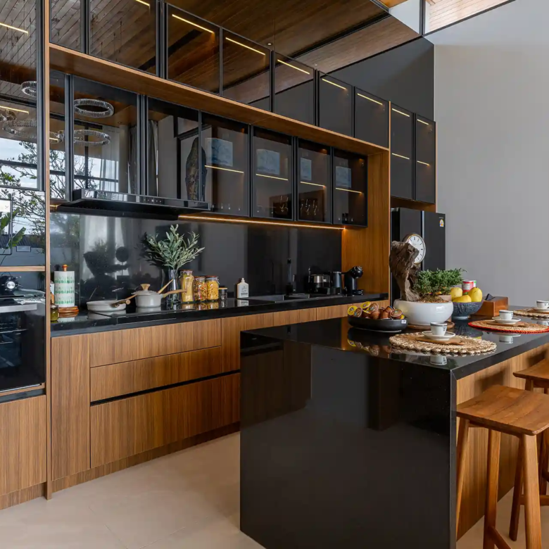 Mouana Cherng Talay modern black stone kitchen with breakfast island
