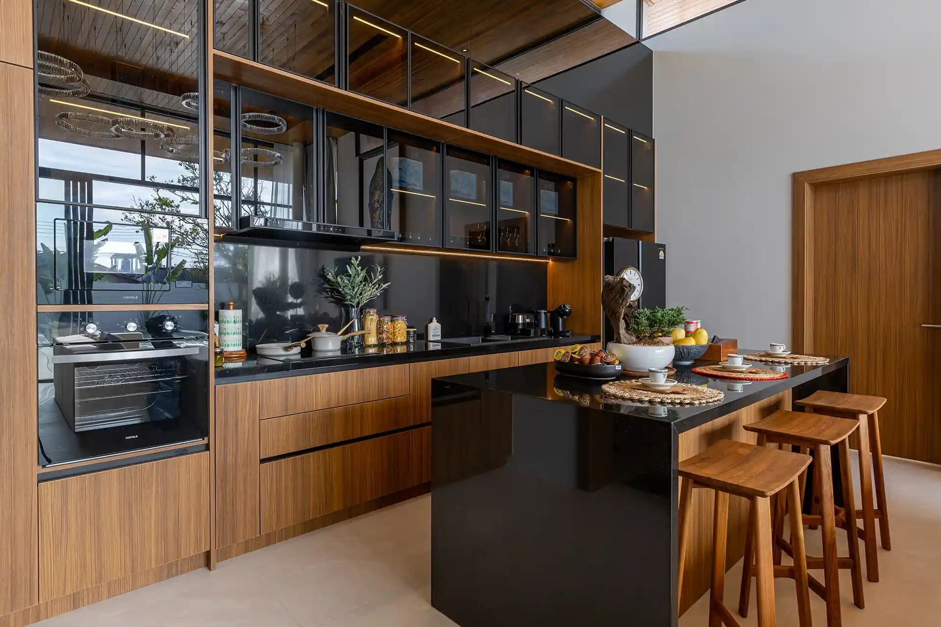 Mouana Cherng Talay modern black stone kitchen with breakfast island