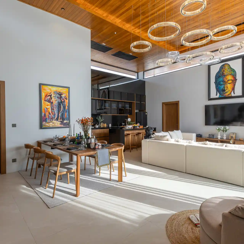 Mouana Cherng Talay open plan living and dining with statement chandeliers