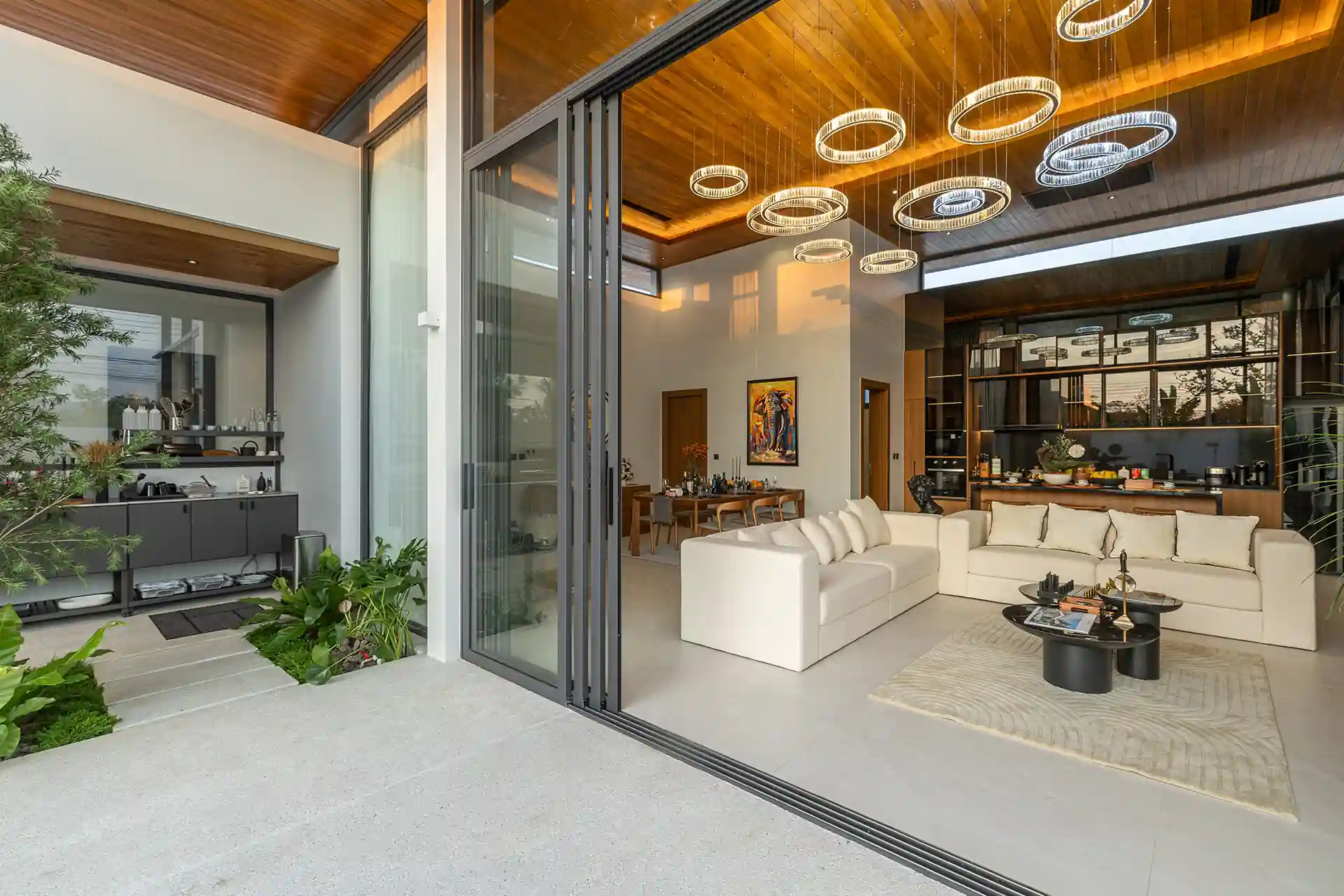Mouana Cherng Talay open-plan living room flowing onto terrace and pool