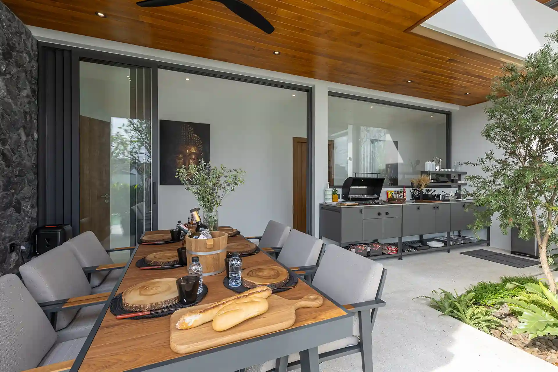 Mouana Cherng Talay covered outdoor dining pavilion with styled table setting