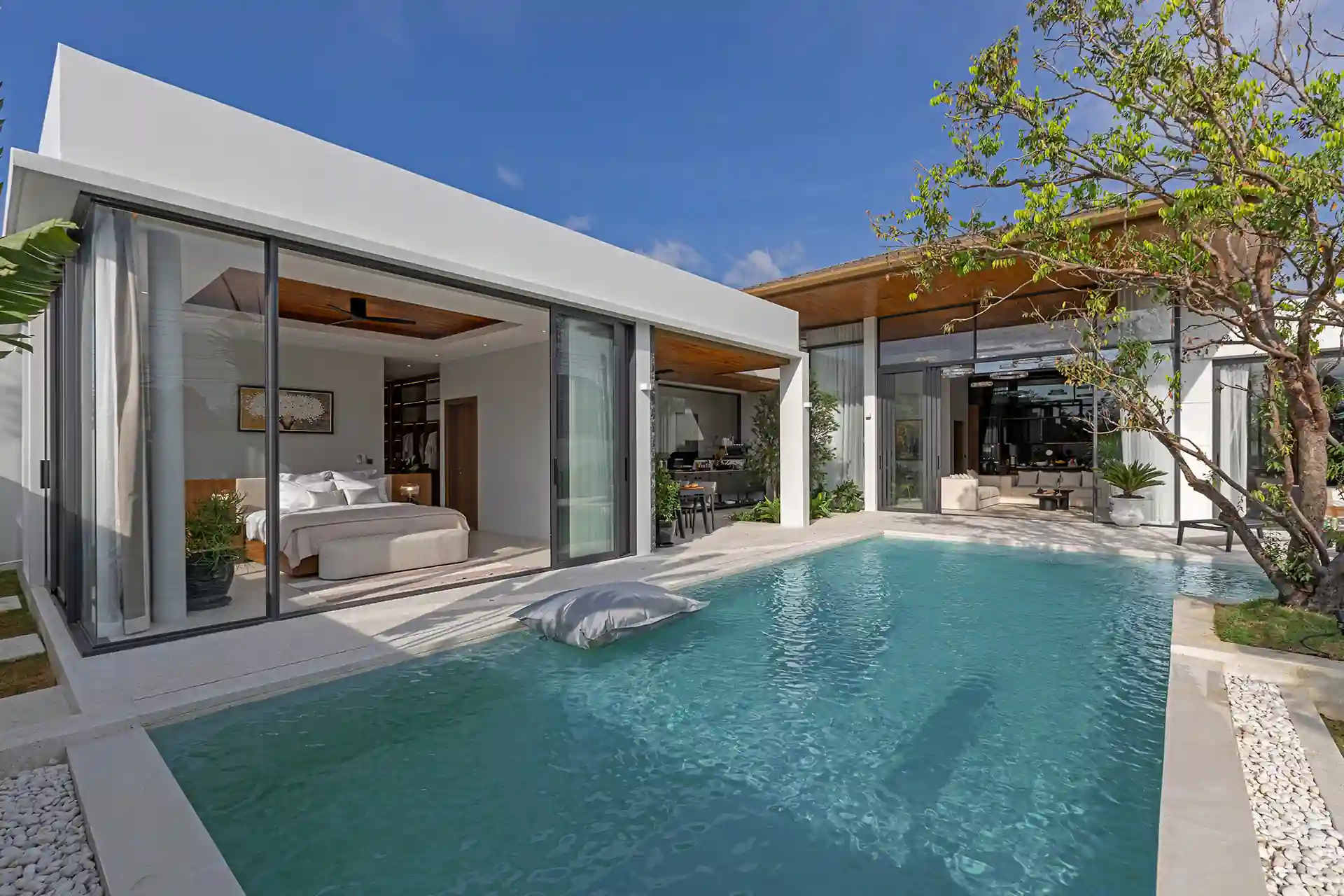Mouana Cherng Talay pool beside glass-front master bedroom pavilion
