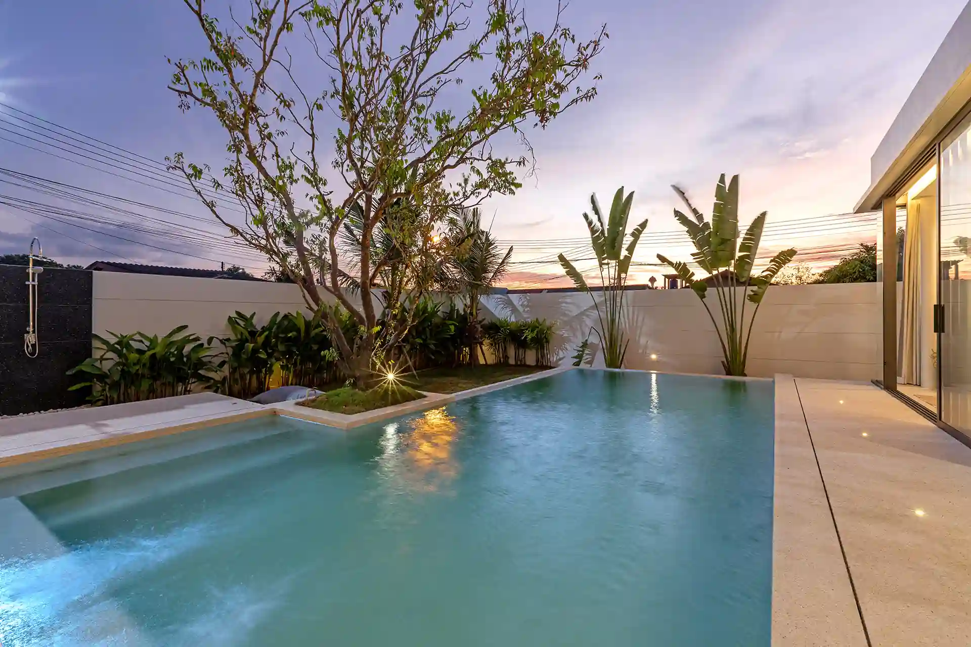 Mouana Cherng Talay pool with shallow steps, garden and evening sky