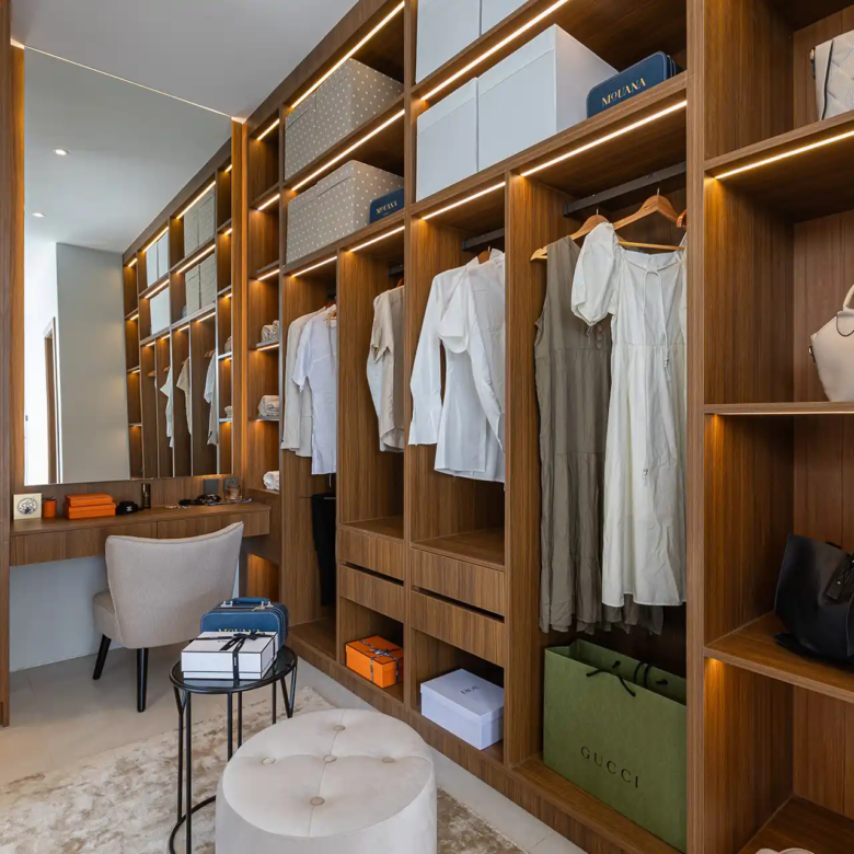 Mouana Cherng Talay walk-in wardrobe with illuminated shelves and vanity