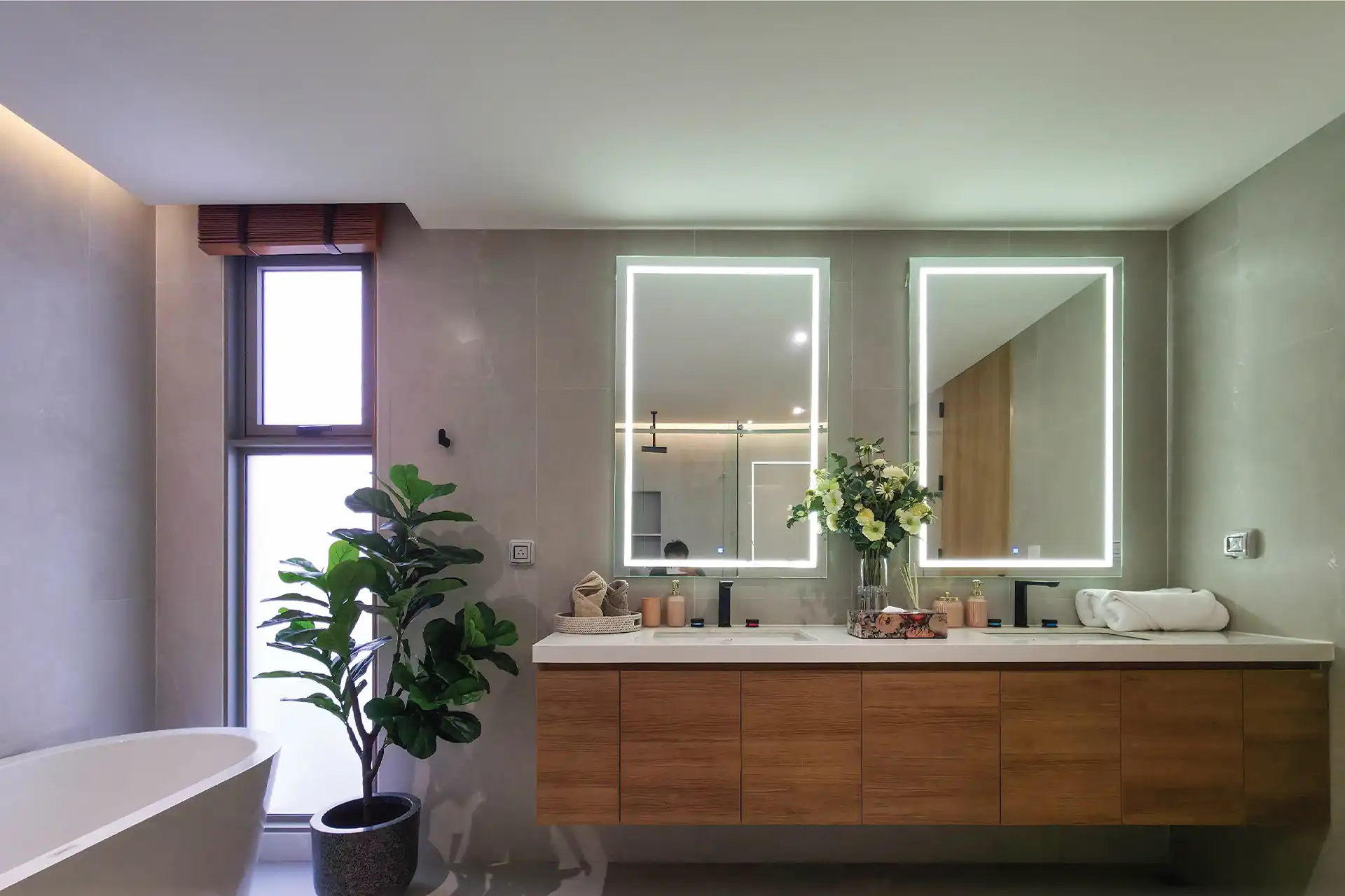 Serene Raya Bangjo bathroom with illuminated double vanity and modern cabinets