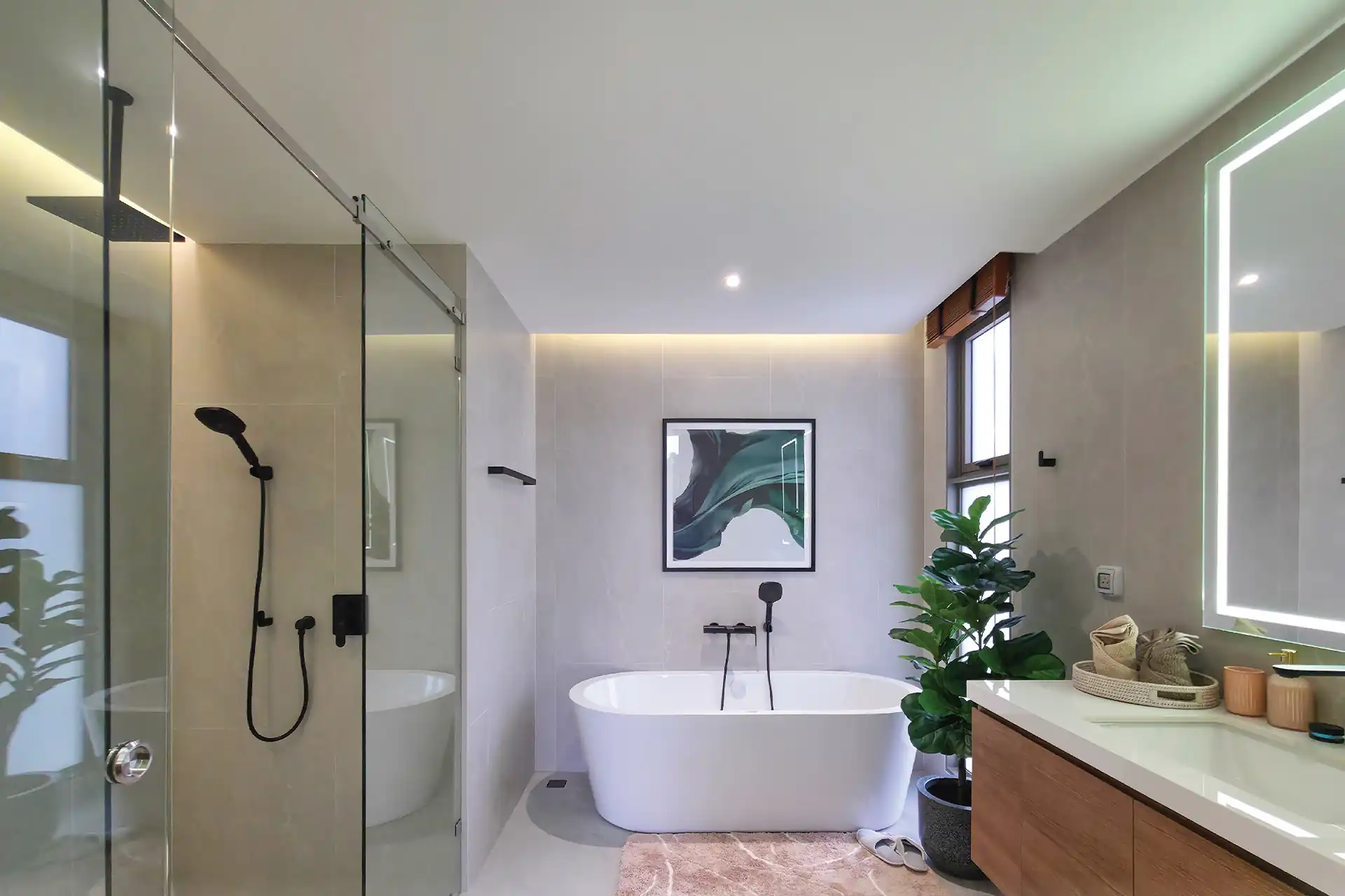 Serene Raya Bangjo bathroom with freestanding bathtub and glass shower enclosure