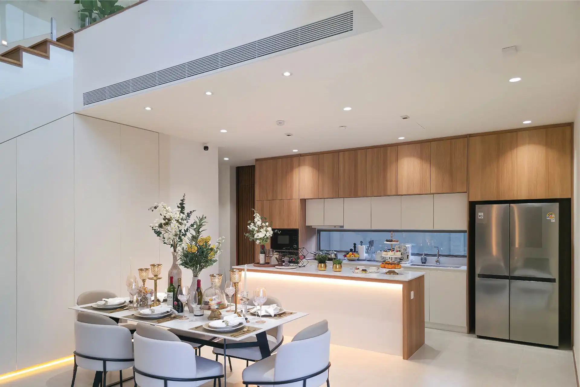 Serene Raya Bangjo elegant dining room beside bright modern kitchen island