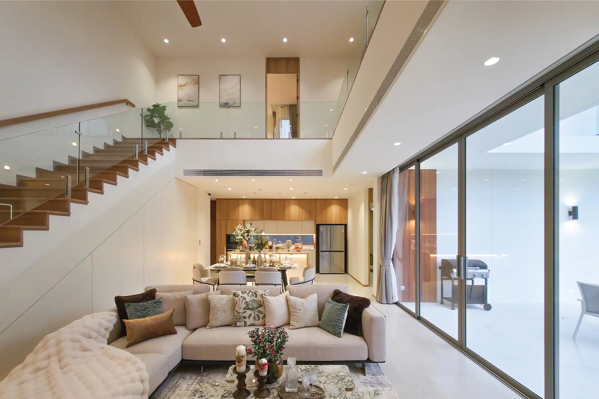Serene Raya Bangjo double-height living and dining with pool view