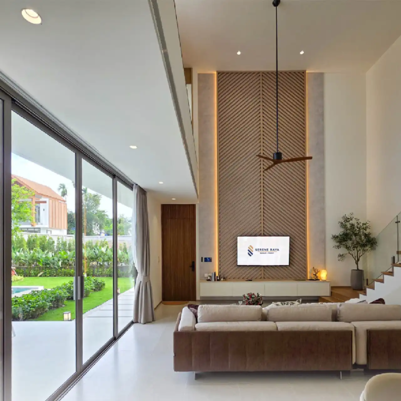 Serene Raya Bangjo living room with full-height glass to garden pool