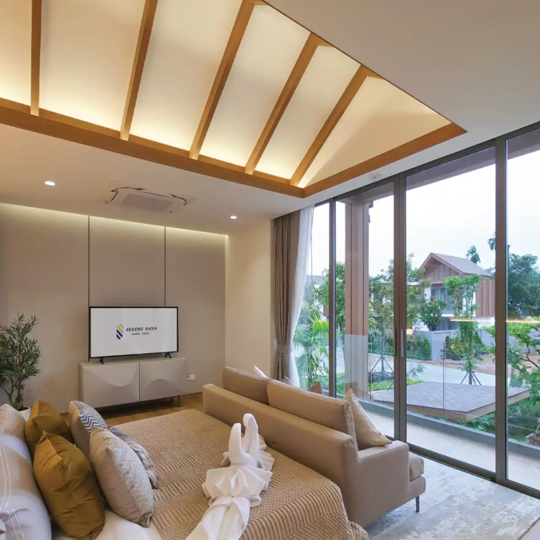 Serene Raya Bangjo master bedroom opening to balcony with garden community view