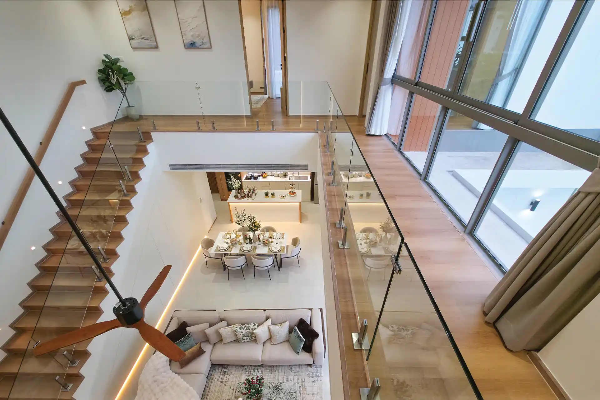 Serene Raya Bangjo mezzanine view overlooking double-volume living and dining