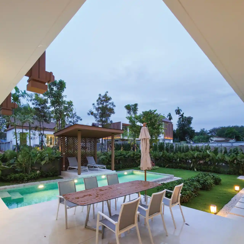 Serene Raya Bangjo covered outdoor dining terrace beside private swimming pool